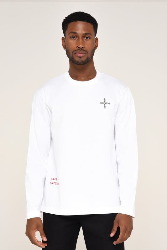 Man wearing a white long-sleeve shirt with cross detail  and red text
